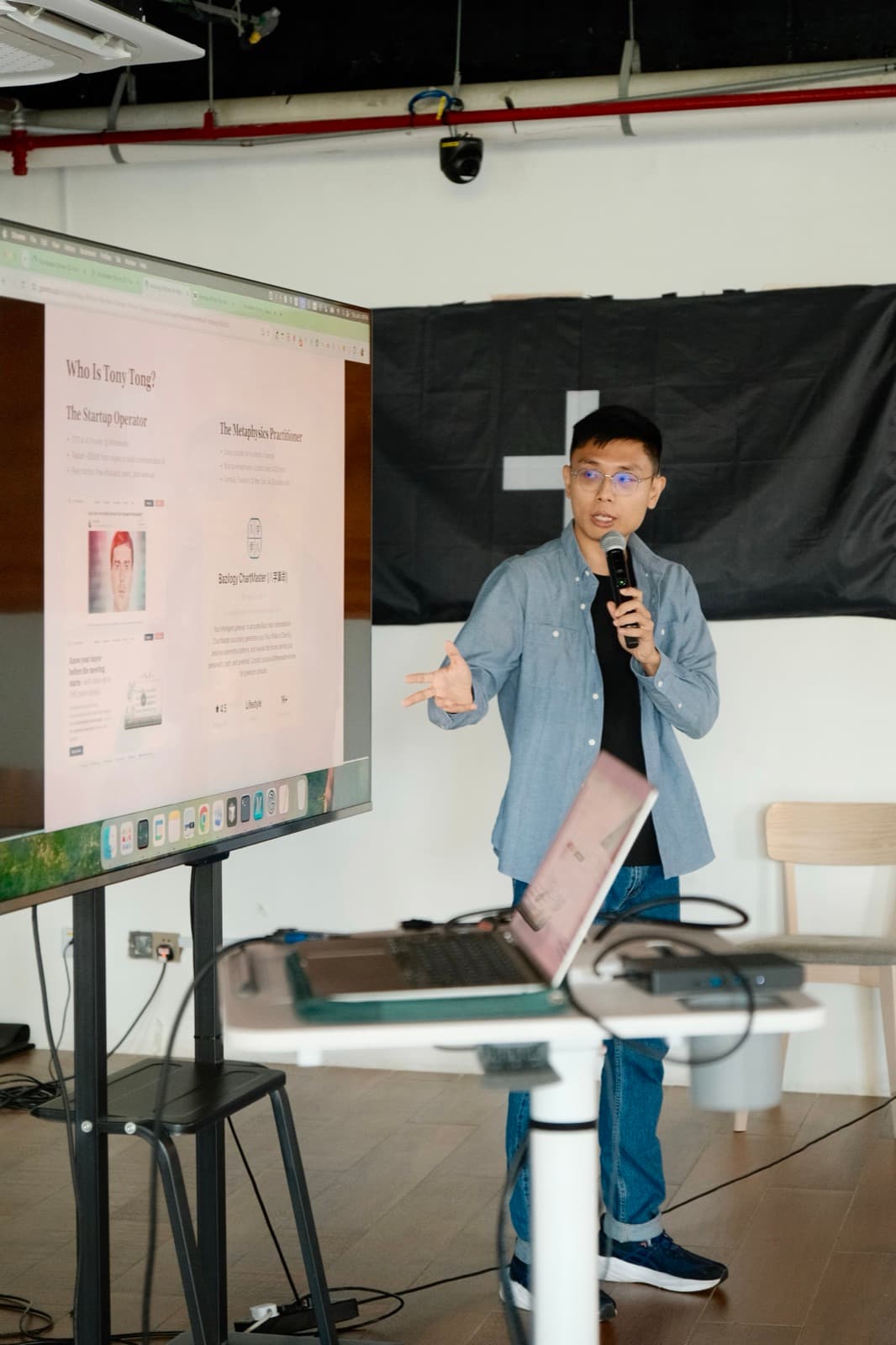 Tony explaining a calibration framework beside a whiteboard.