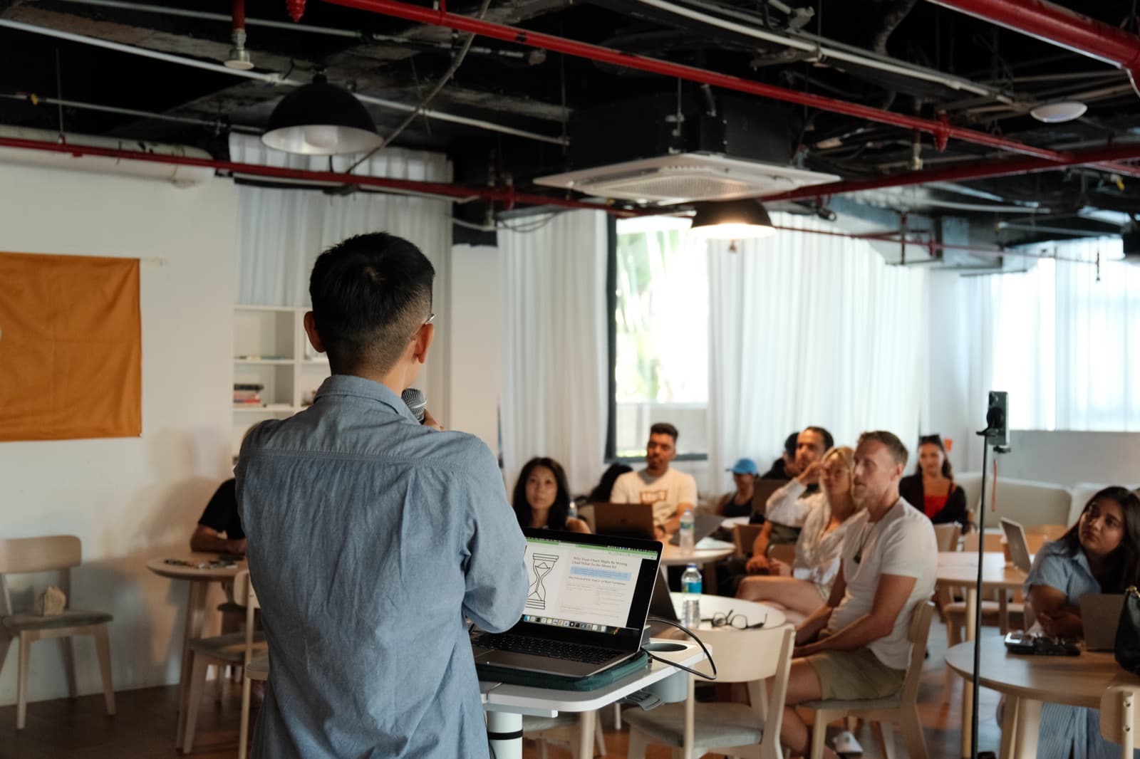 Tony presenting to workshop participants from the front of the room.