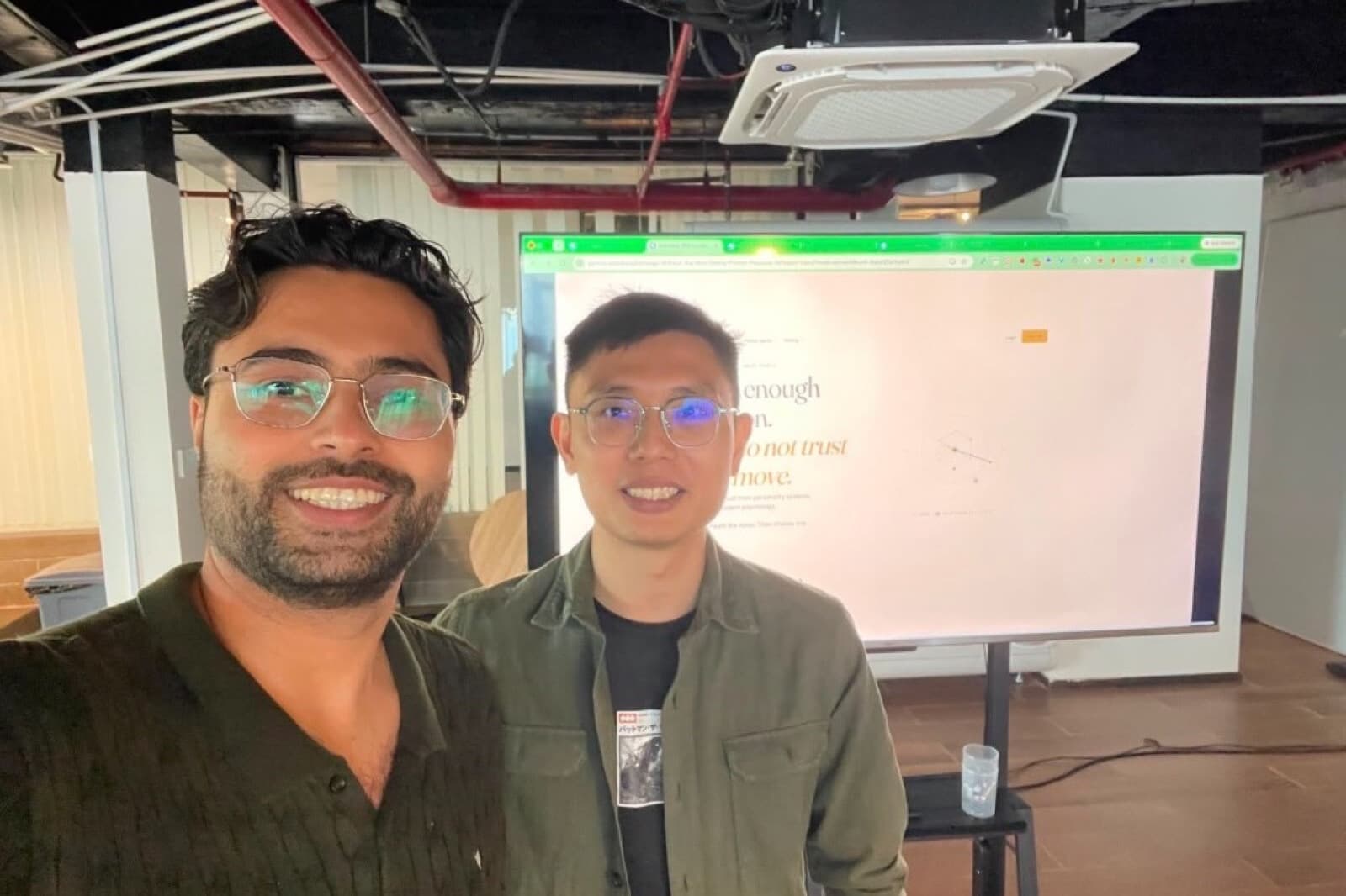 Tony with a workshop participant in front of The Modern Shrine product screen.